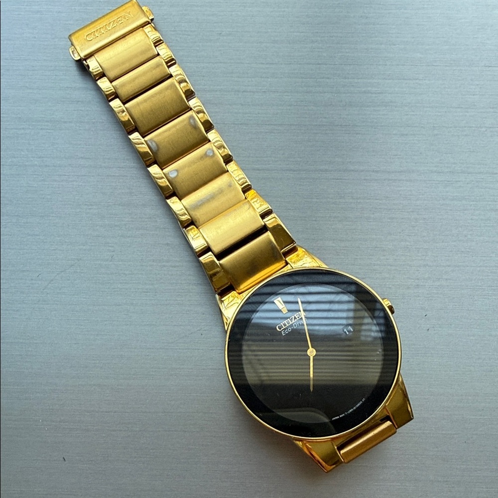 Citizen Gold Timepiece with Black Face